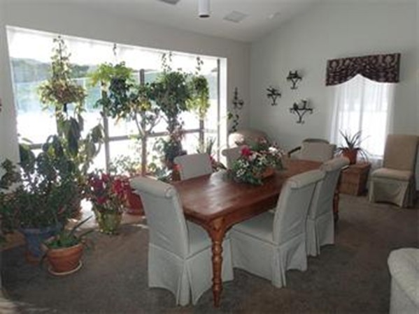 6 Post Oak Lane, Unit 4 Natick, MA 01760 - Photo 17 of 18 a view of a dining room with furniture window and outside view