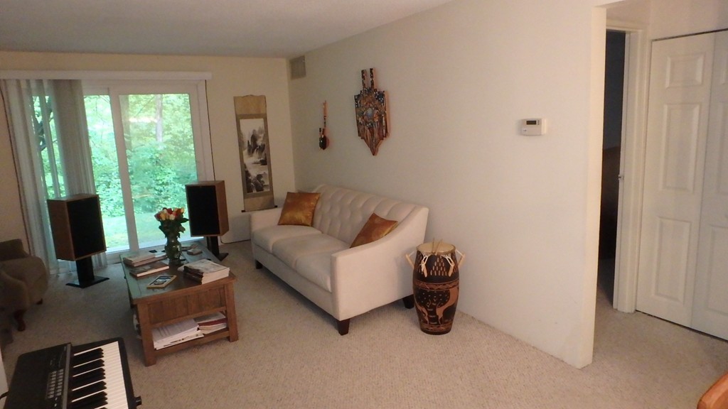 6 Post Oak Lane, Unit 4 Natick, MA 01760 - Photo 4 of 18 a living room with furniture and a window