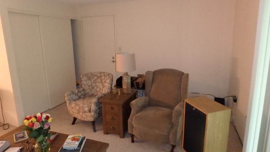 6 Post Oak Lane, Unit 4 Natick, MA 01760 - Photo 5 of 18 a couch sitting in a room next to a window