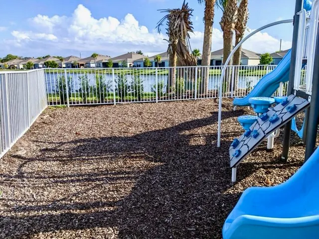 a view of a house with a yard from a corridor