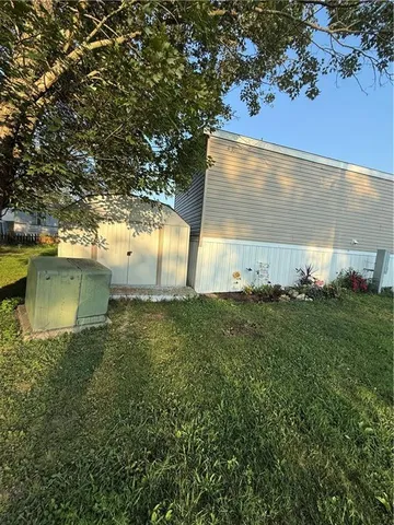 a view of a back yard of a house