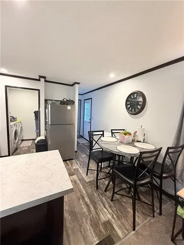 a kitchen with a table and chairs in it