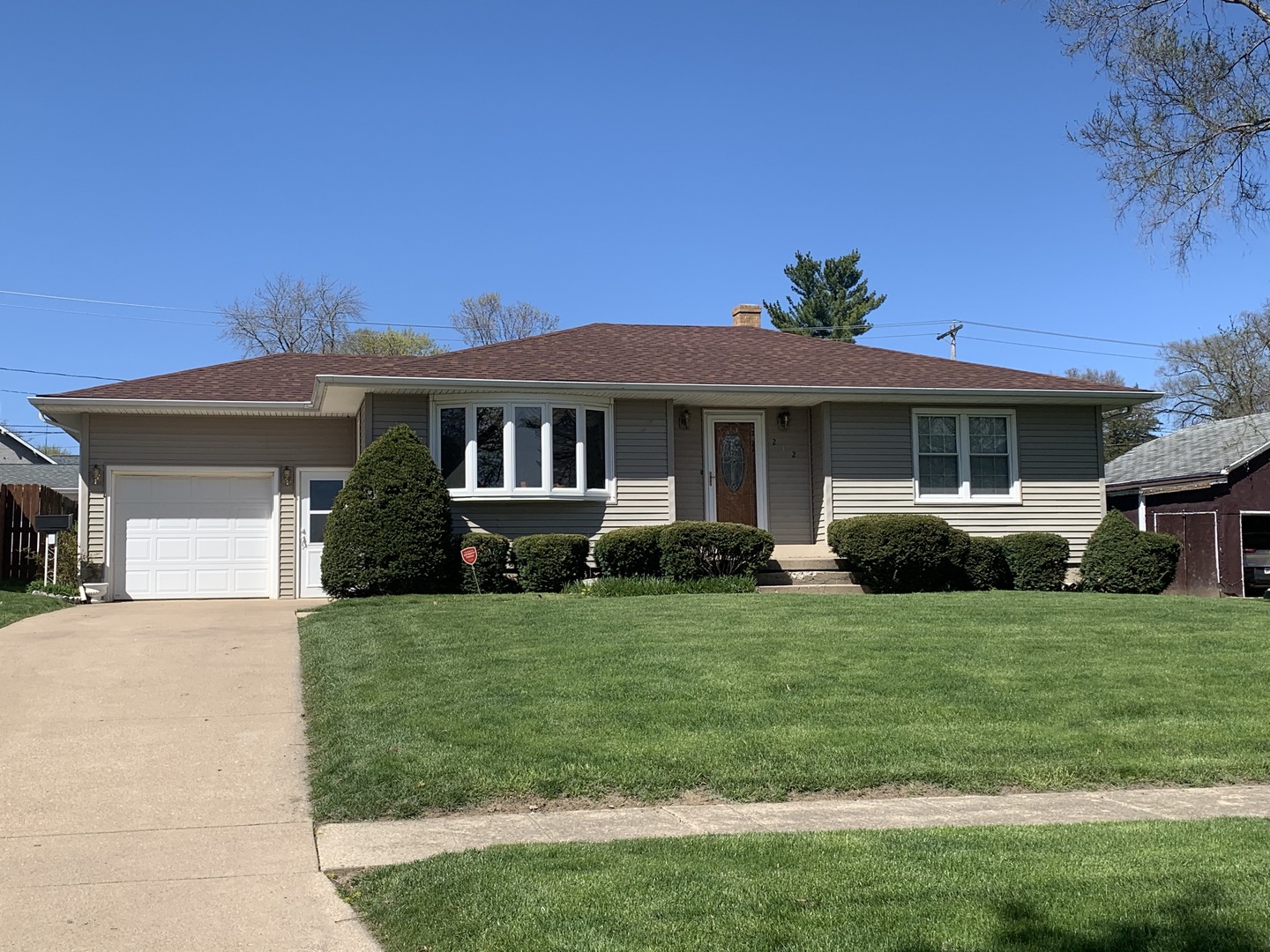 212 West Iowa Street Spring Valley, IL 61362 - Photo 1 of 18 a front view of a house with a yard