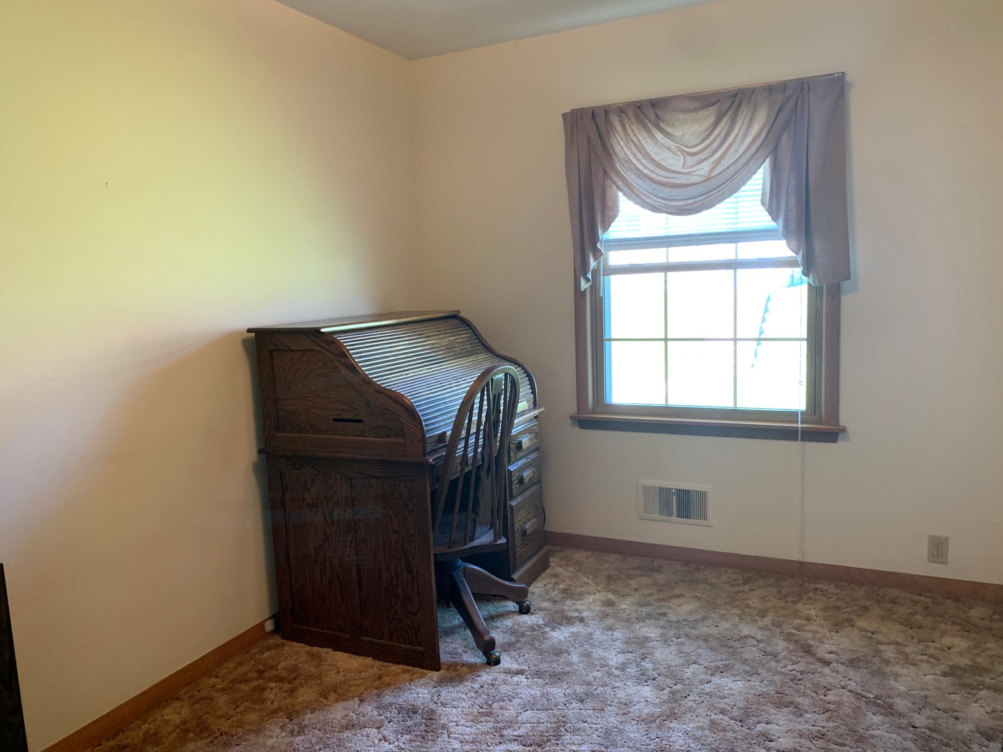 212 West Iowa Street Spring Valley, IL 61362 - Photo 11 of 18 a bedroom with a bed and a window