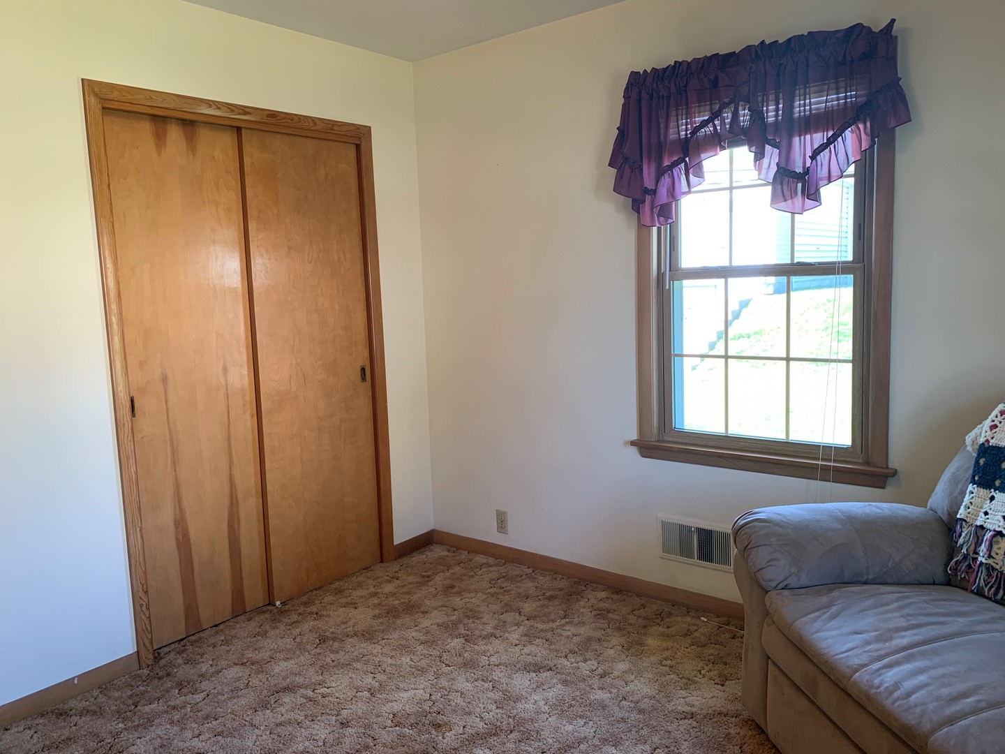 212 West Iowa Street Spring Valley, IL 61362 - Photo 13 of 18 a living room with a couch and a window