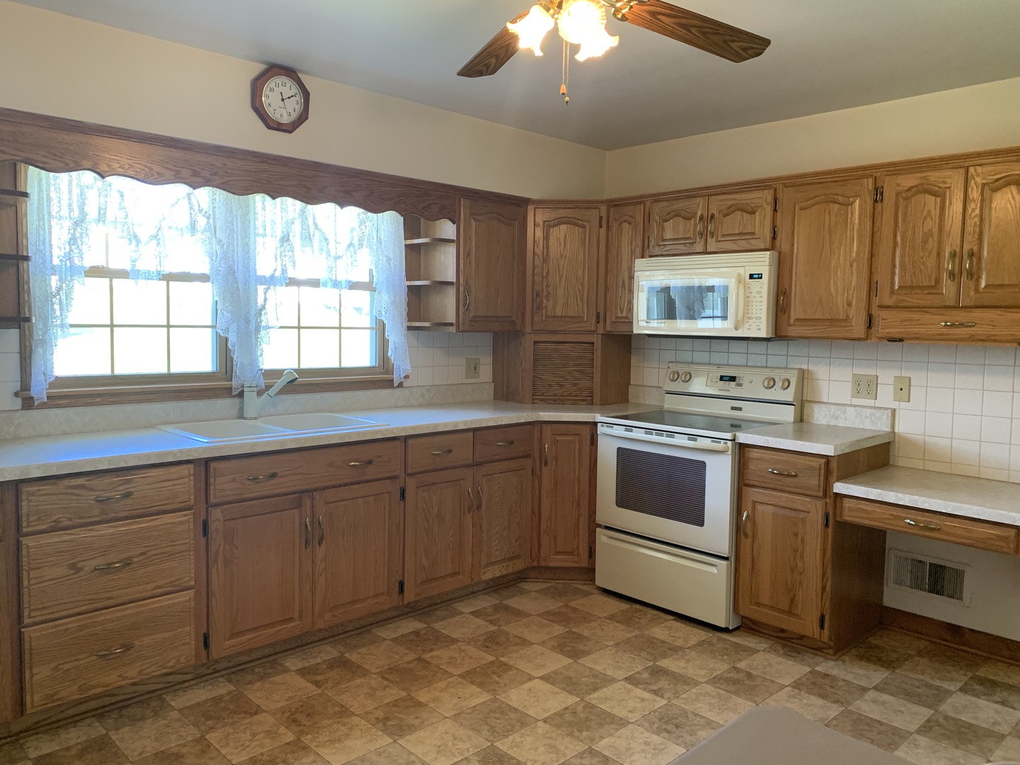 212 West Iowa Street Spring Valley, IL 61362 - Photo 7 of 18 a kitchen with stainless steel appliances granite countertop a stove and a sink