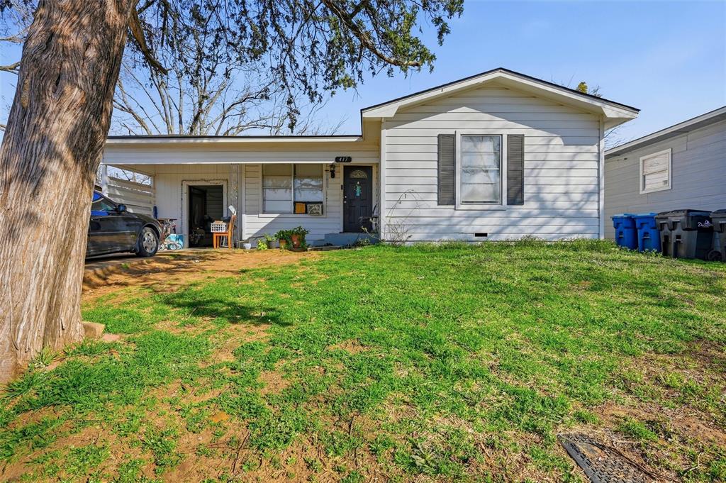 417 East Morton Street Denison, TX 75021 - Photo 1 of 9 a front view of a house with a yard