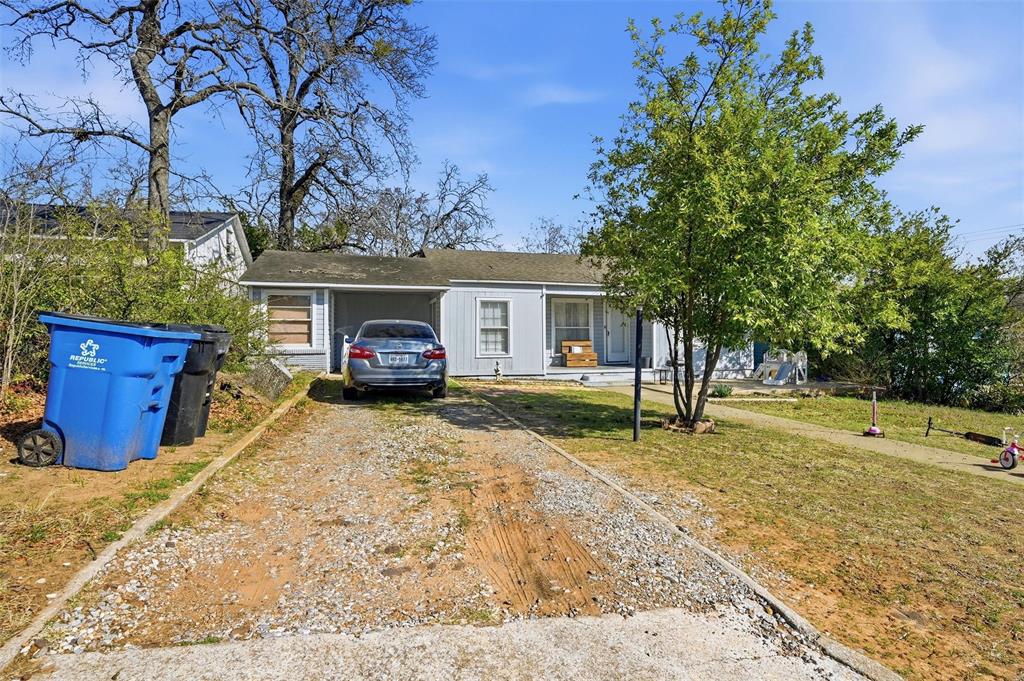 417 East Morton Street Denison, TX 75021 - Photo 2 of 9 a house view with a backyard space