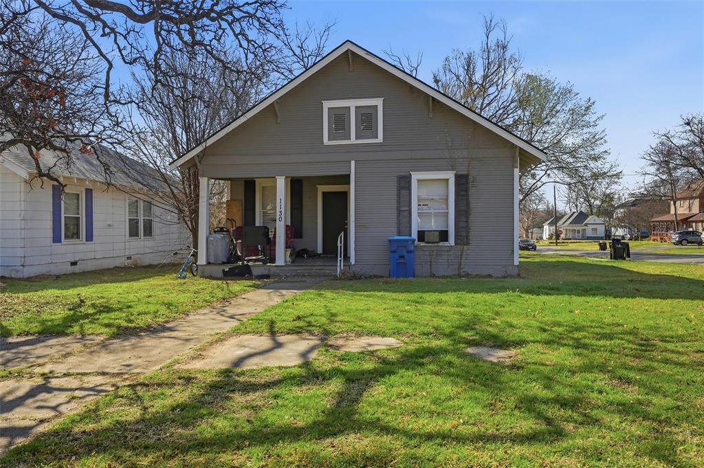 417 East Morton Street Denison, TX 75021 - Photo 5 of 9 a view of a house with a yard