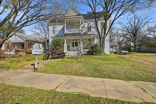 a view of a building with a yard