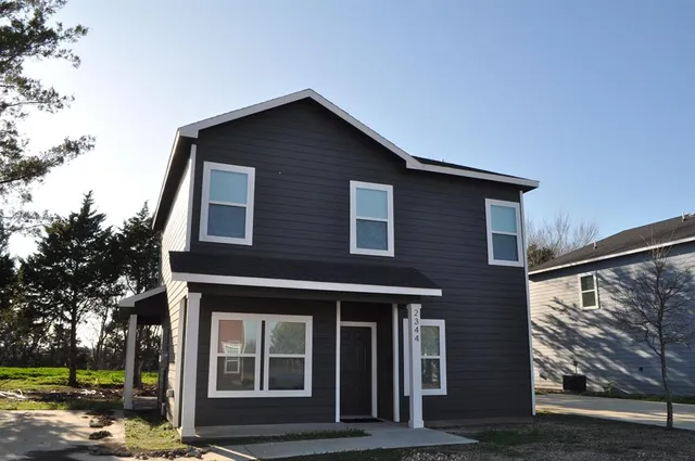 a front view of a house with glass windows