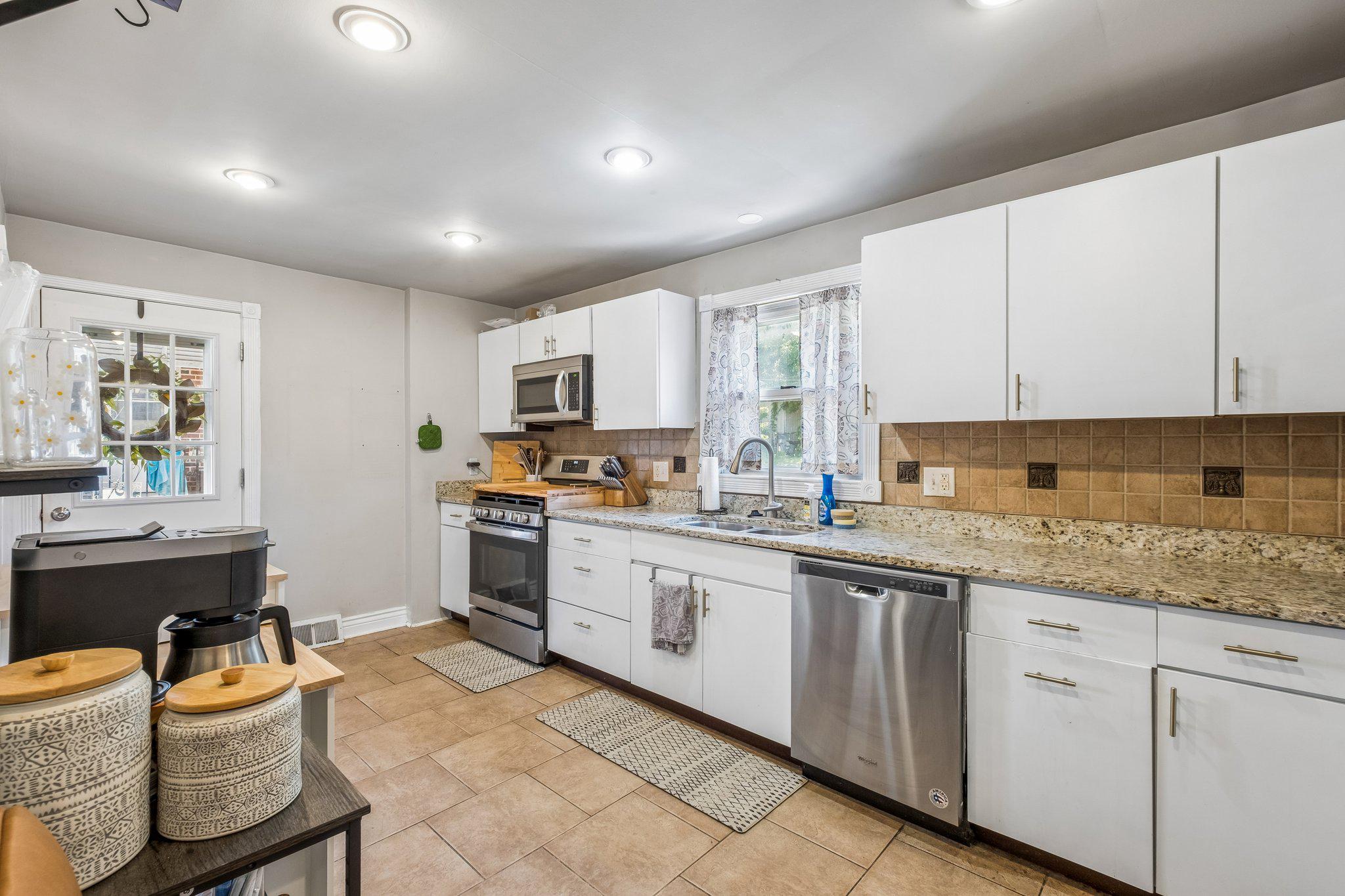 725 Hill Road Philadelphia, PA 19128 - Photo 12 of 43 a kitchen with granite countertop appliances cabinets and furniture
