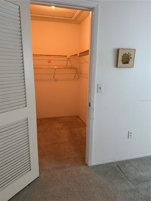 3957 Lakeside Way, Unit 143 Sarasota, FL 34232 - Photo 11 of 26 an empty room with wooden door