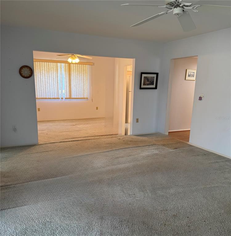 3957 Lakeside Way, Unit 143 Sarasota, FL 34232 - Photo 12 of 26 an empty room with windows