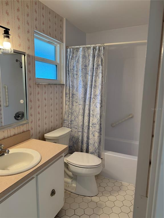 3957 Lakeside Way, Unit 143 Sarasota, FL 34232 - Photo 16 of 26 a bathroom with a sink toilet and shower