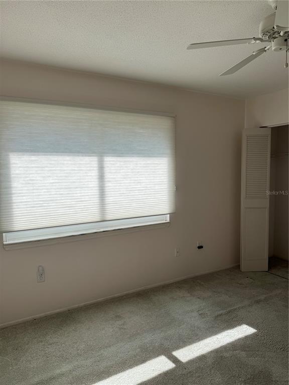 3957 Lakeside Way, Unit 143 Sarasota, FL 34232 - Photo 18 of 26 a view of an empty room with a window
