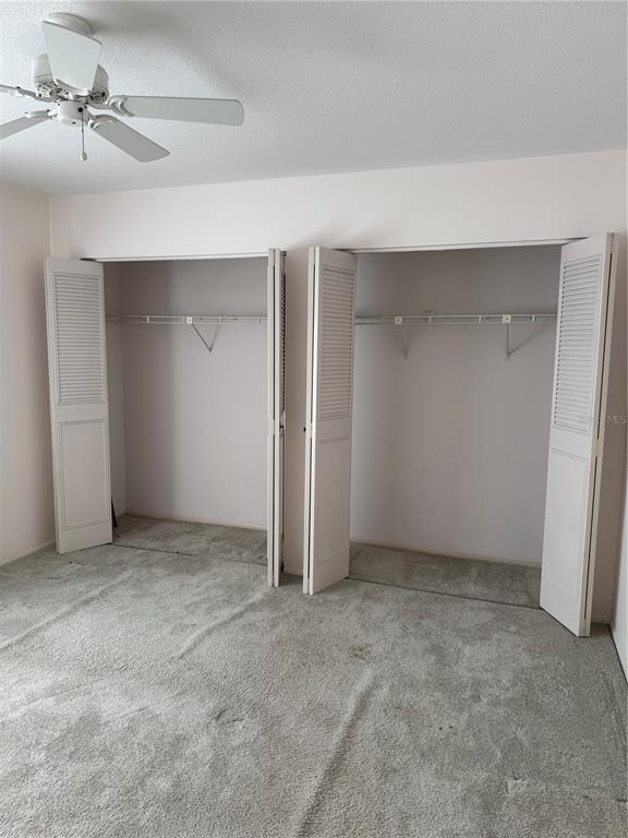 3957 Lakeside Way, Unit 143 Sarasota, FL 34232 - Photo 19 of 26 an empty room with a ceiling fan