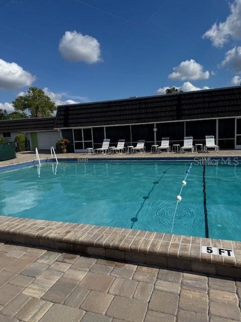 3957 Lakeside Way, Unit 143 Sarasota, FL 34232 - Photo 21 of 26 a view of a house with backyard and a garden