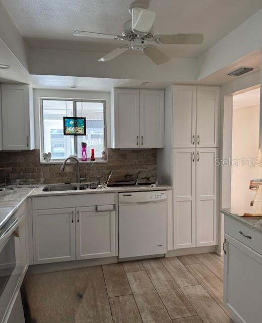 3957 Lakeside Way, Unit 143 Sarasota, FL 34232 - Photo 6 of 26 a kitchen with a sink cabinets and window