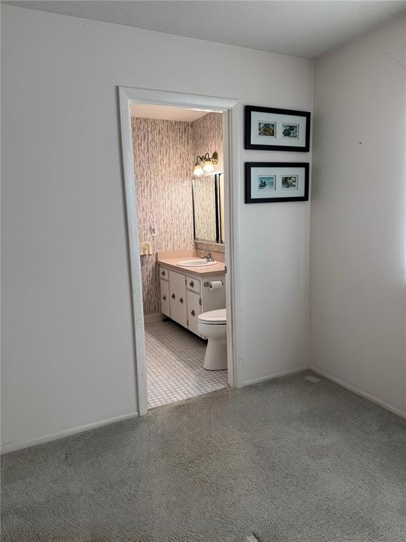 3957 Lakeside Way, Unit 143 Sarasota, FL 34232 - Photo 10 of 26 an empty room with window and mirror