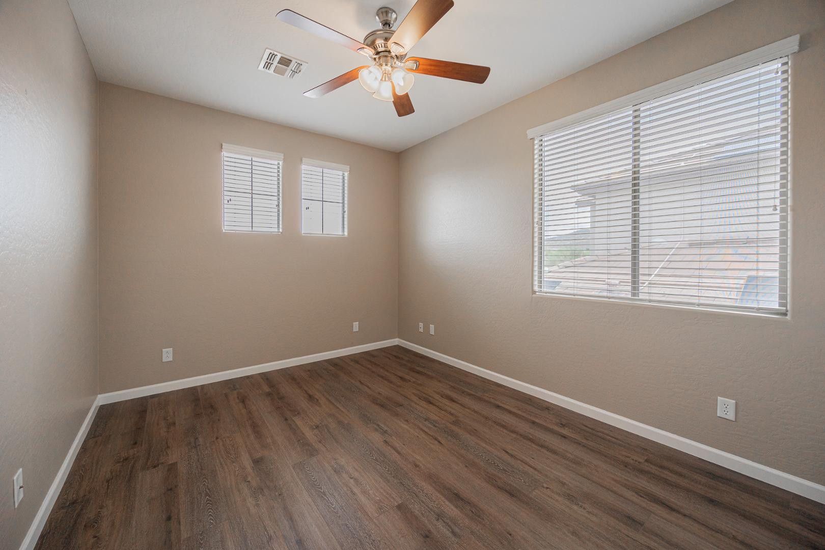 6539 West Jomax Road Phoenix, AZ 85083 - Photo 24 of 39 wooden floor in an empty room with a window
