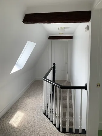 a spacious bathroom with a sink and a mirror