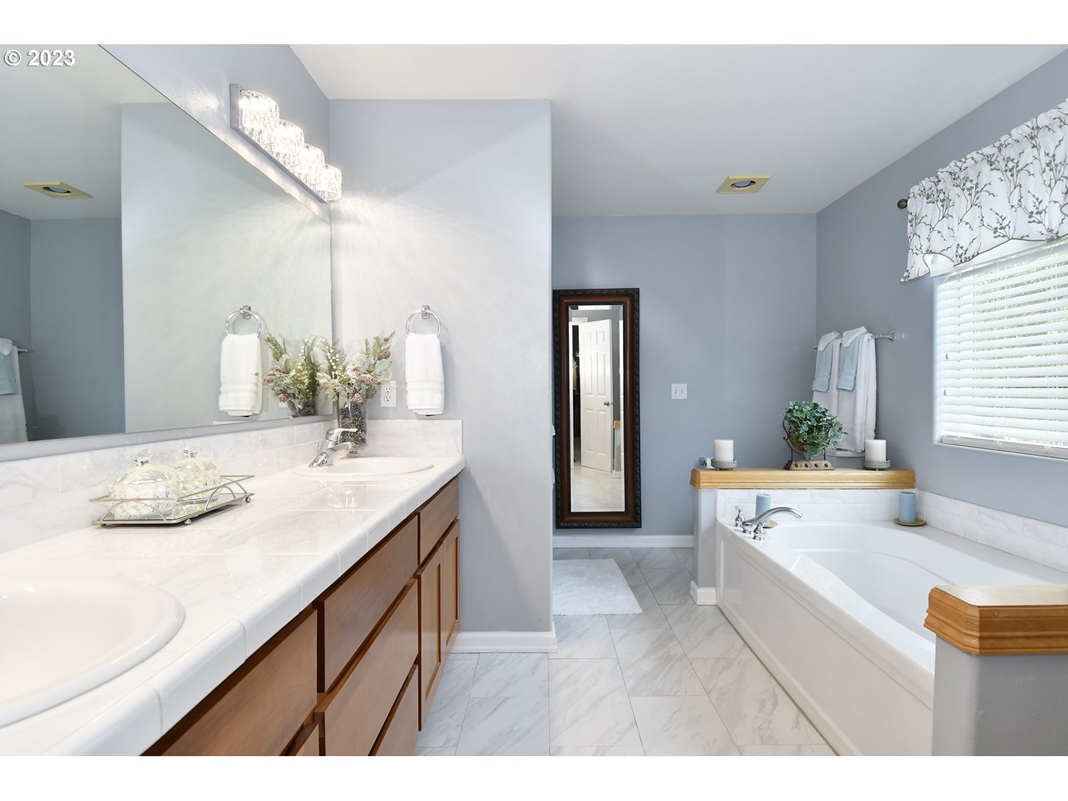 2112 Northwest 10th Street Battle Ground, WA 98604 - Photo 21 of 29 a bathroom with a sink double vanity granite and a large mirror