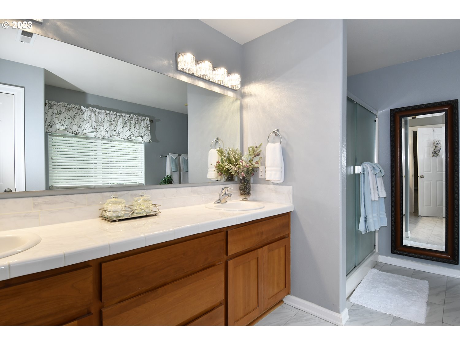 2112 Northwest 10th Street Battle Ground, WA 98604 - Photo 22 of 29 a bathroom with a sink and a mirror
