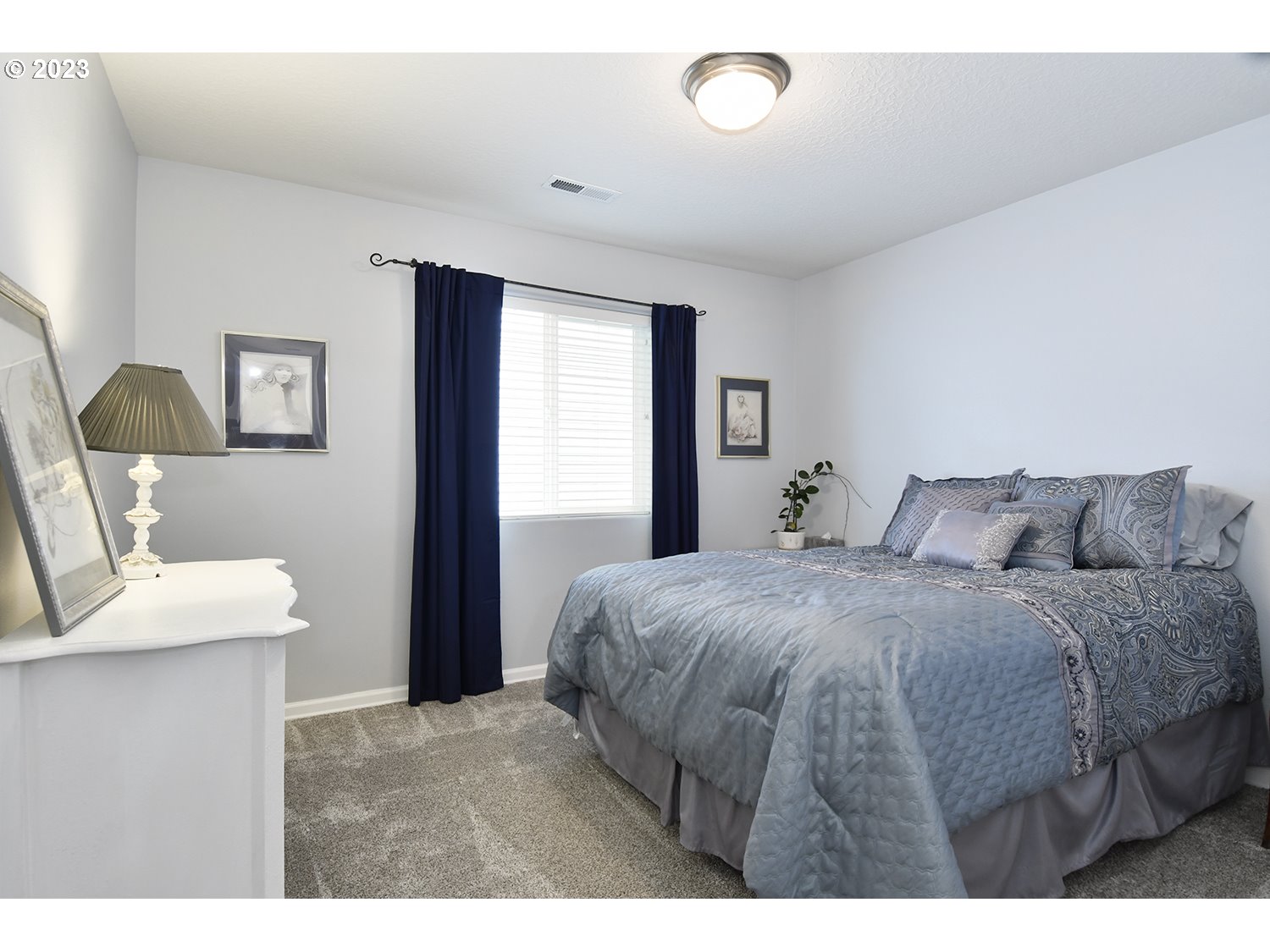 2112 Northwest 10th Street Battle Ground, WA 98604 - Photo 24 of 29 a bedroom with a bed and a table in it