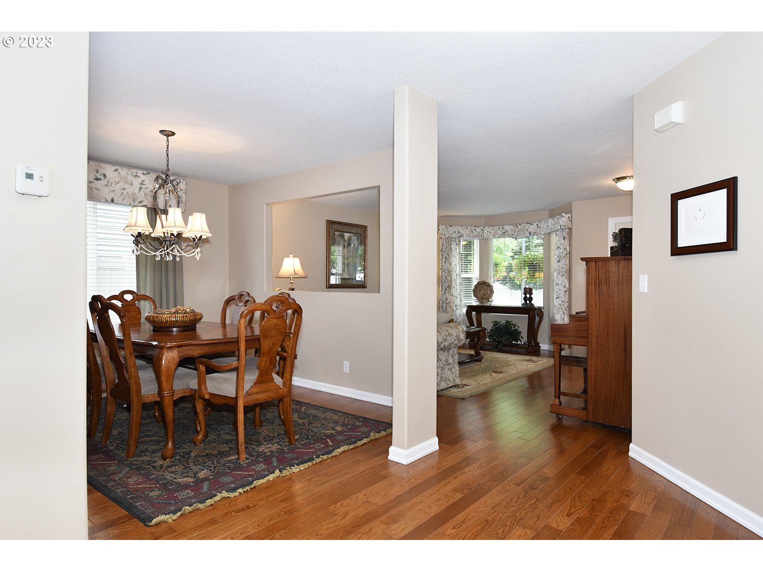 2112 Northwest 10th Street Battle Ground, WA 98604 - Photo 6 of 29 a dining room with furniture a chandelier and wooden floor