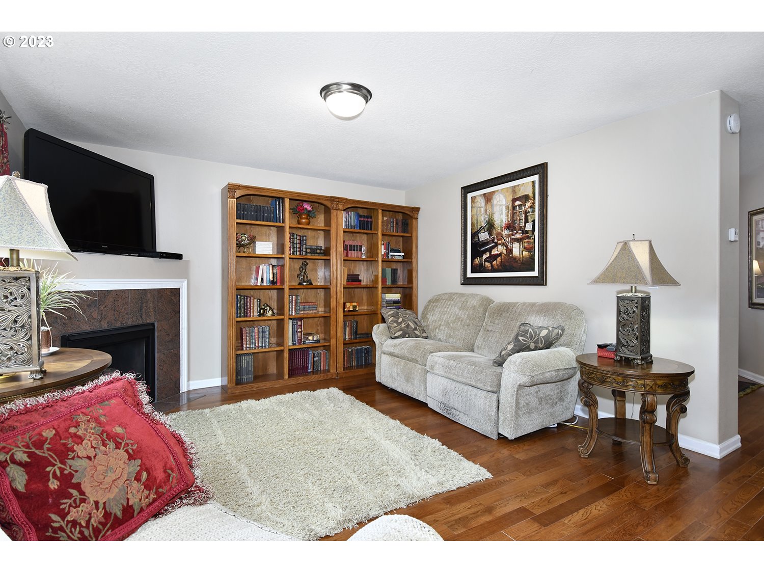 2112 Northwest 10th Street Battle Ground, WA 98604 - Photo 10 of 29 a living room with furniture fireplace and a flat screen tv