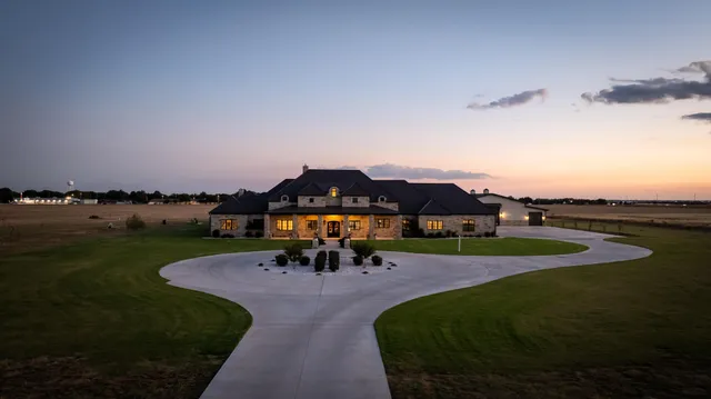 a house view with swimming pool in front of it