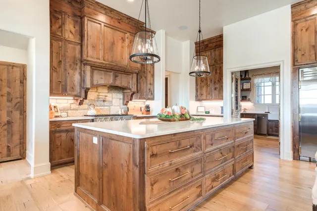 a view of a house with potted plants