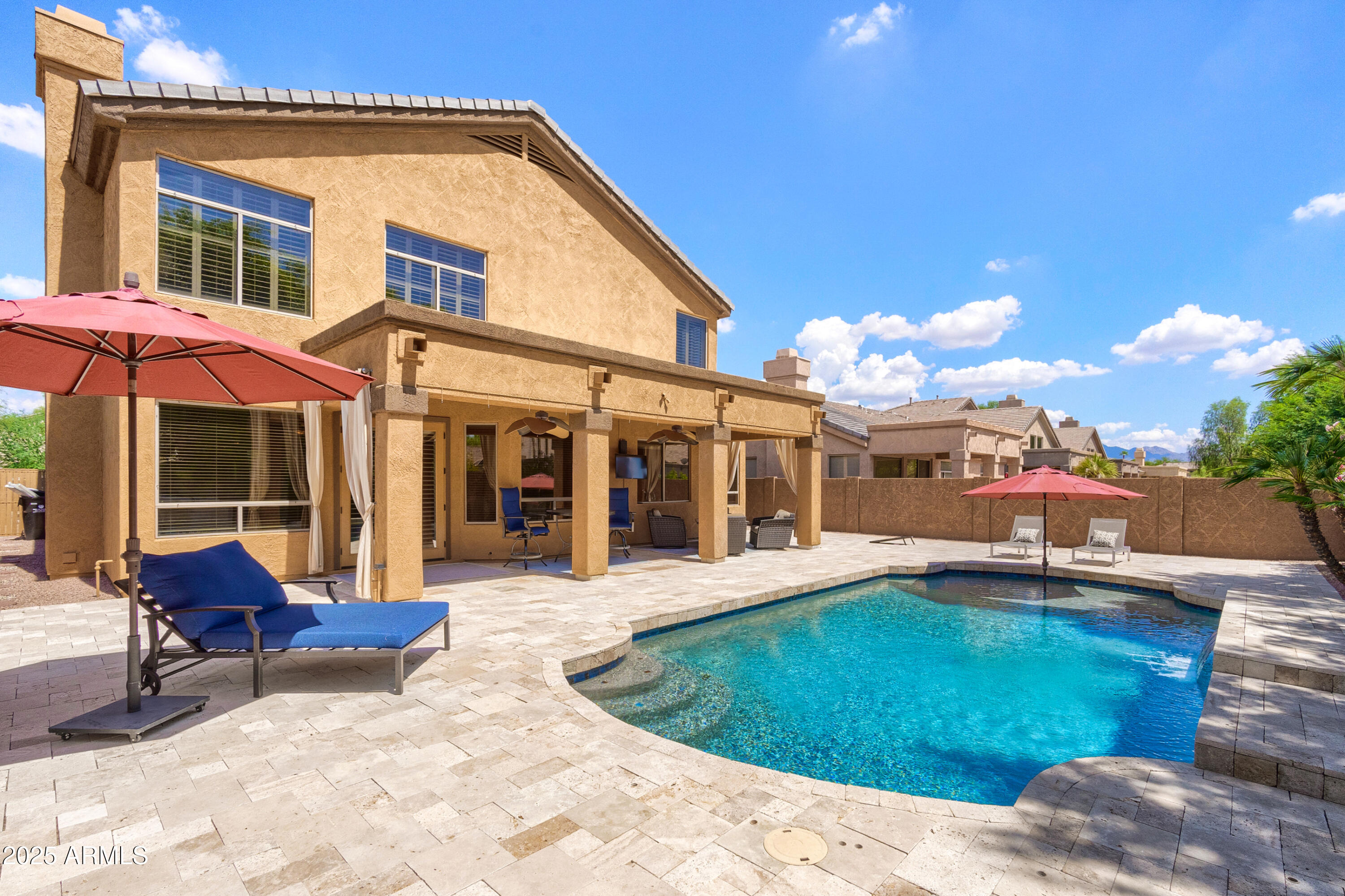 6419 East Betty Elyse Lane Scottsdale, AZ 85254 - Photo 1 of 33 a view of a house with a swimming pool and sitting area