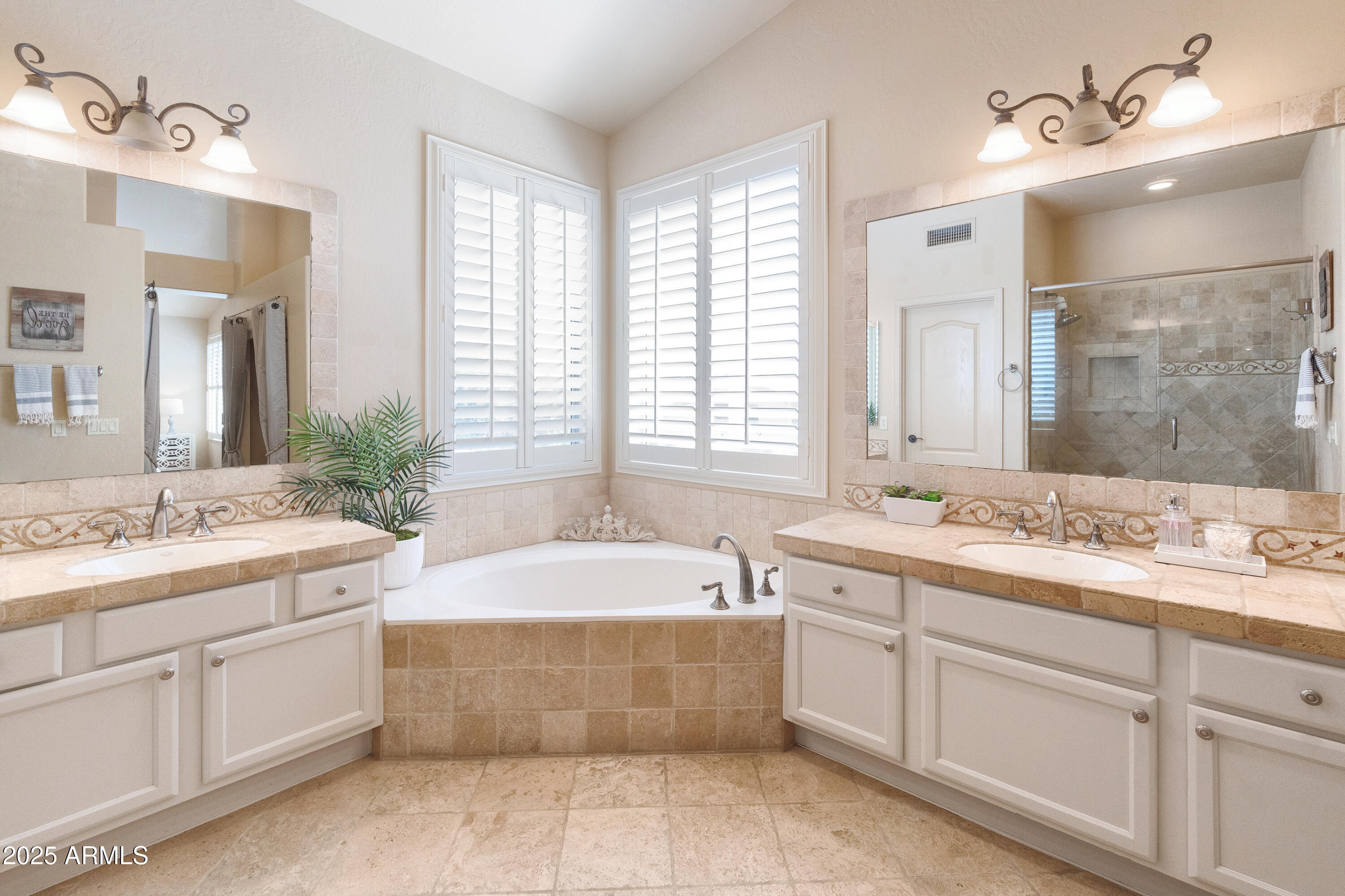 6419 East Betty Elyse Lane Scottsdale, AZ 85254 - Photo 11 of 33 a bathroom with a granite countertop bathtub sink vanity and mirror