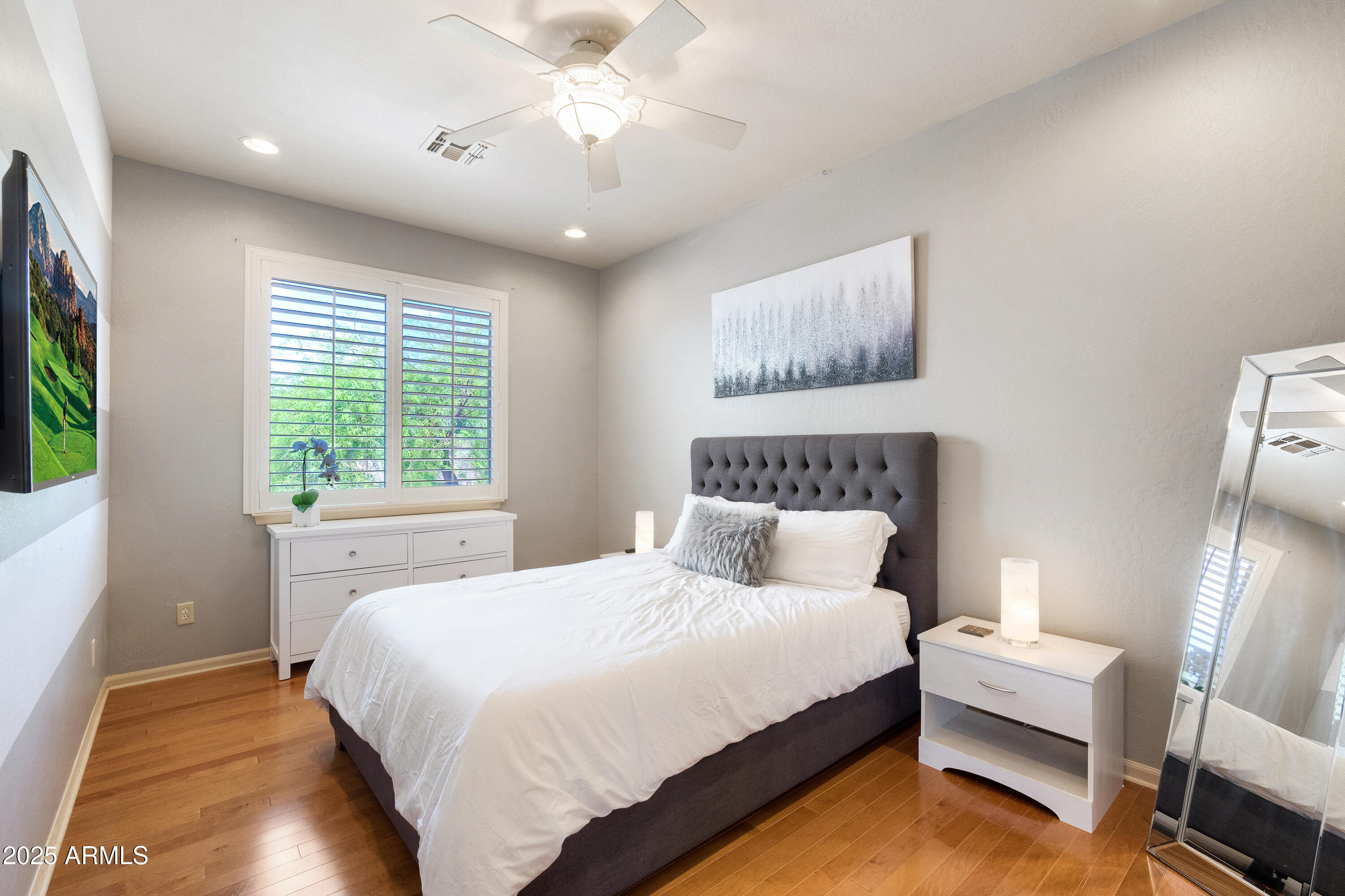 6419 East Betty Elyse Lane Scottsdale, AZ 85254 - Photo 13 of 33 a bedroom with bed and a window