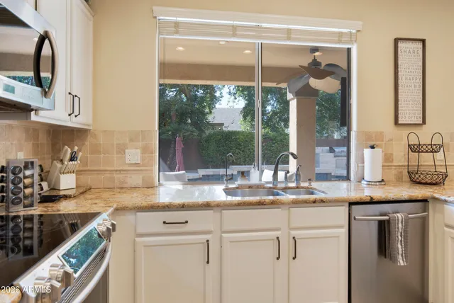 a view of a dining room with furniture and a window