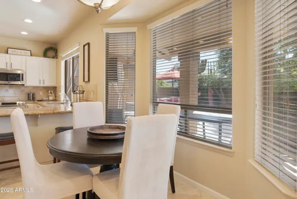 a view of a dining room with furniture and a window