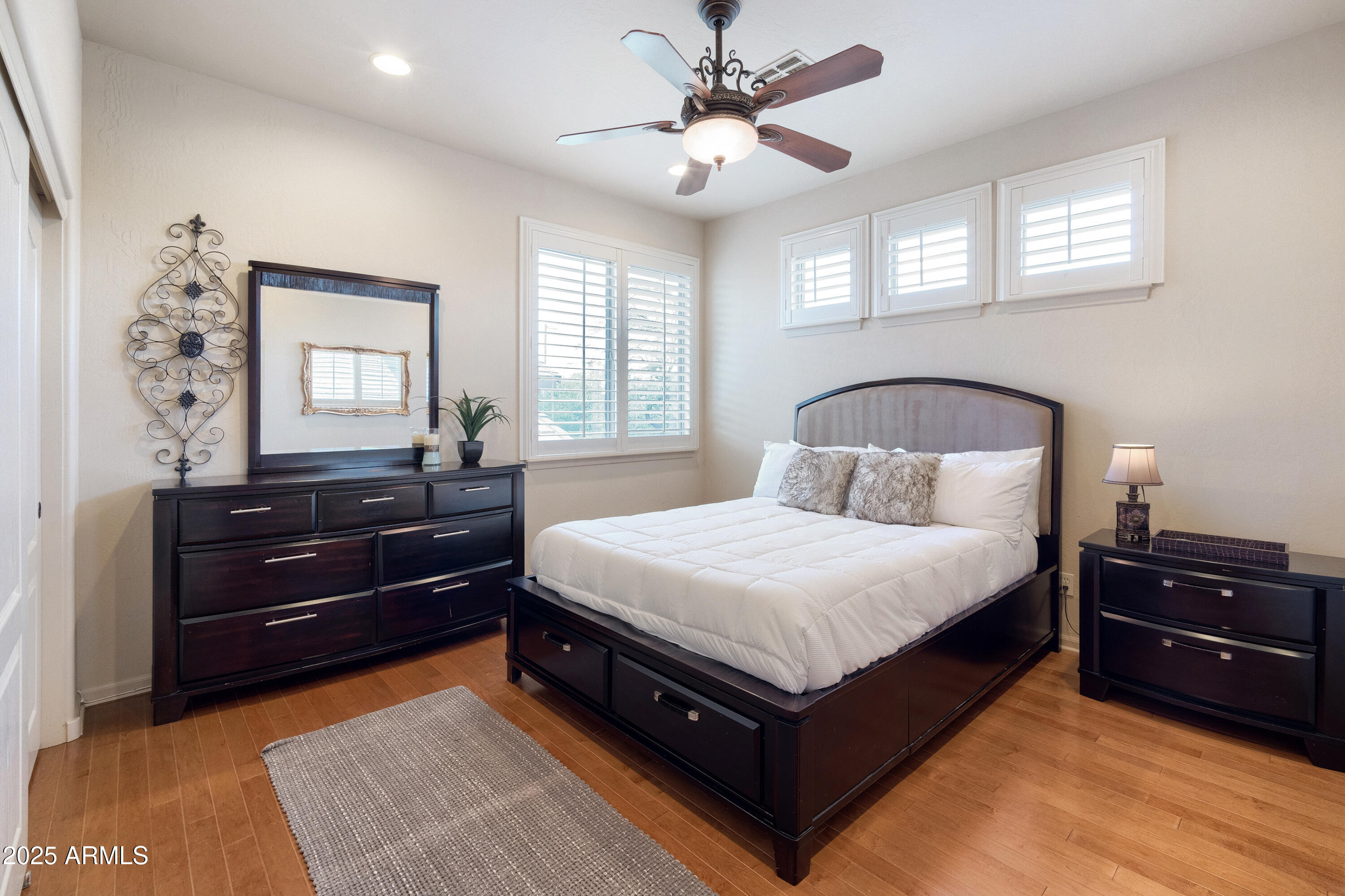 6419 East Betty Elyse Lane Scottsdale, AZ 85254 - Photo 16 of 33 a bedroom with a bed and window with lamp