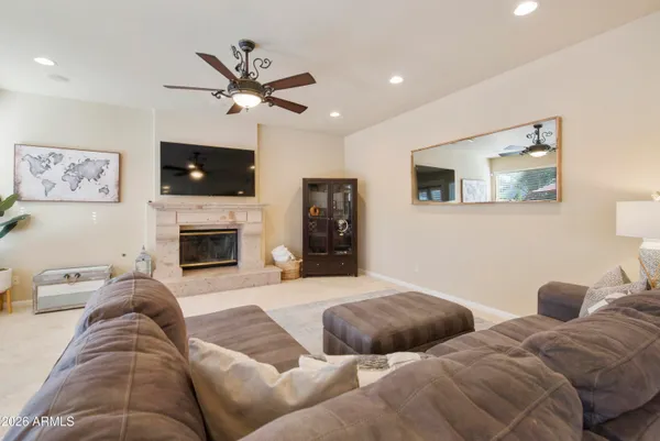 a living room with furniture and a fireplace