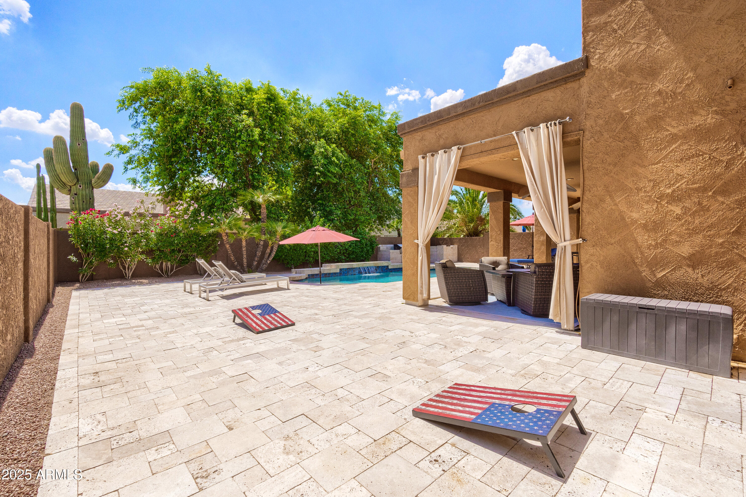 6419 East Betty Elyse Lane Scottsdale, AZ 85254 - Photo 25 of 33 a view of backyard with swimming pool and furniture