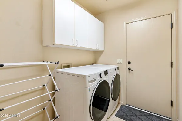 a bedroom with furniture and a flat screen tv
