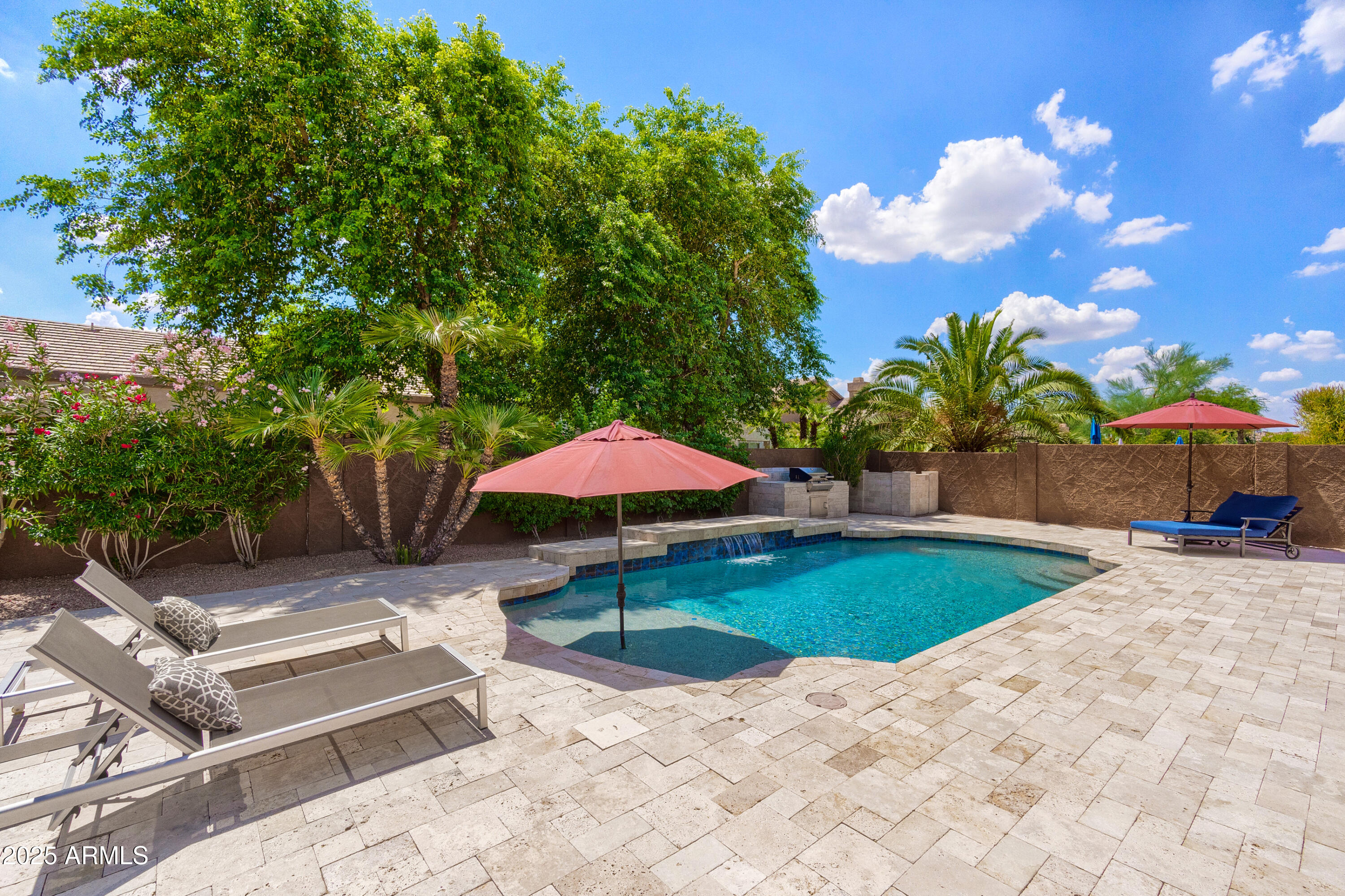 6419 East Betty Elyse Lane Scottsdale, AZ 85254 - Photo 27 of 33 a view of a backyard with under an umbrella