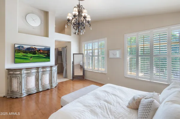 a bedroom with a bed and a lamp