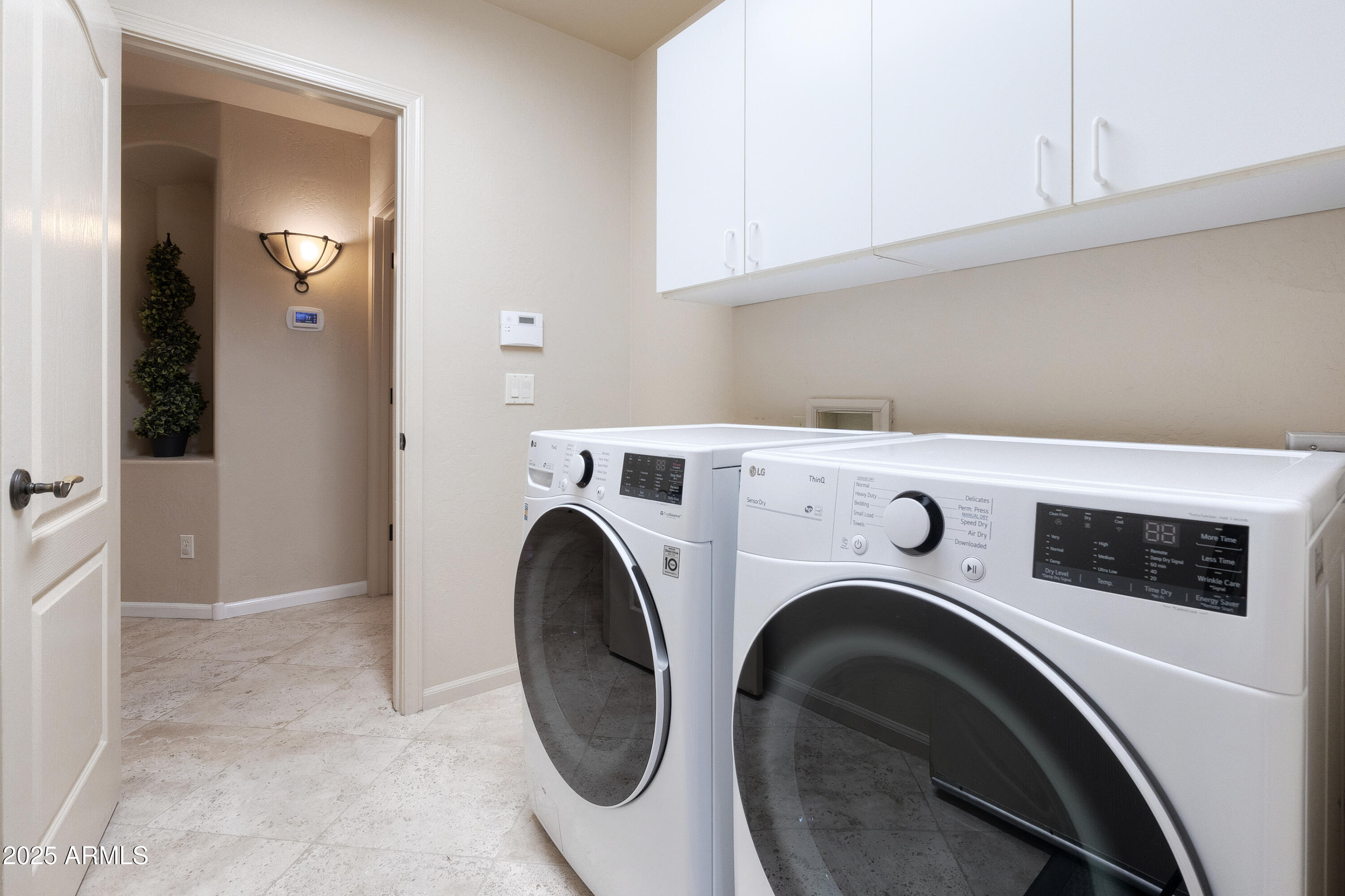 6419 East Betty Elyse Lane Scottsdale, AZ 85254 - Photo 29 of 33 a utility room with dryer and washer