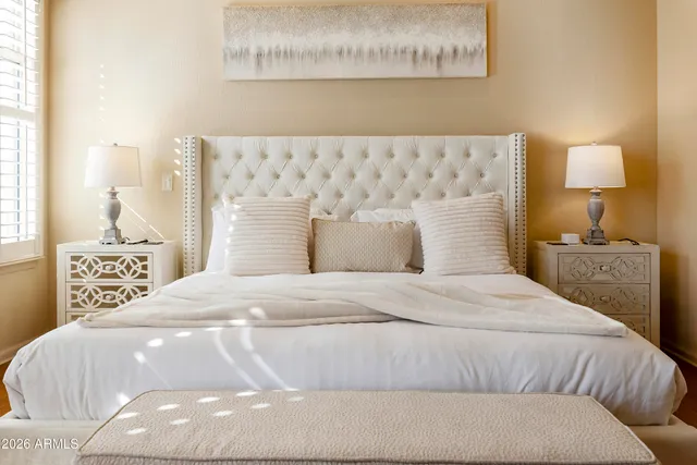 a spacious bathroom with a granite countertop sink mirror and shower