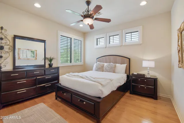 a bedroom with a large bed and a window