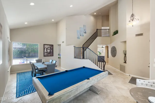 a living room with furniture and a table