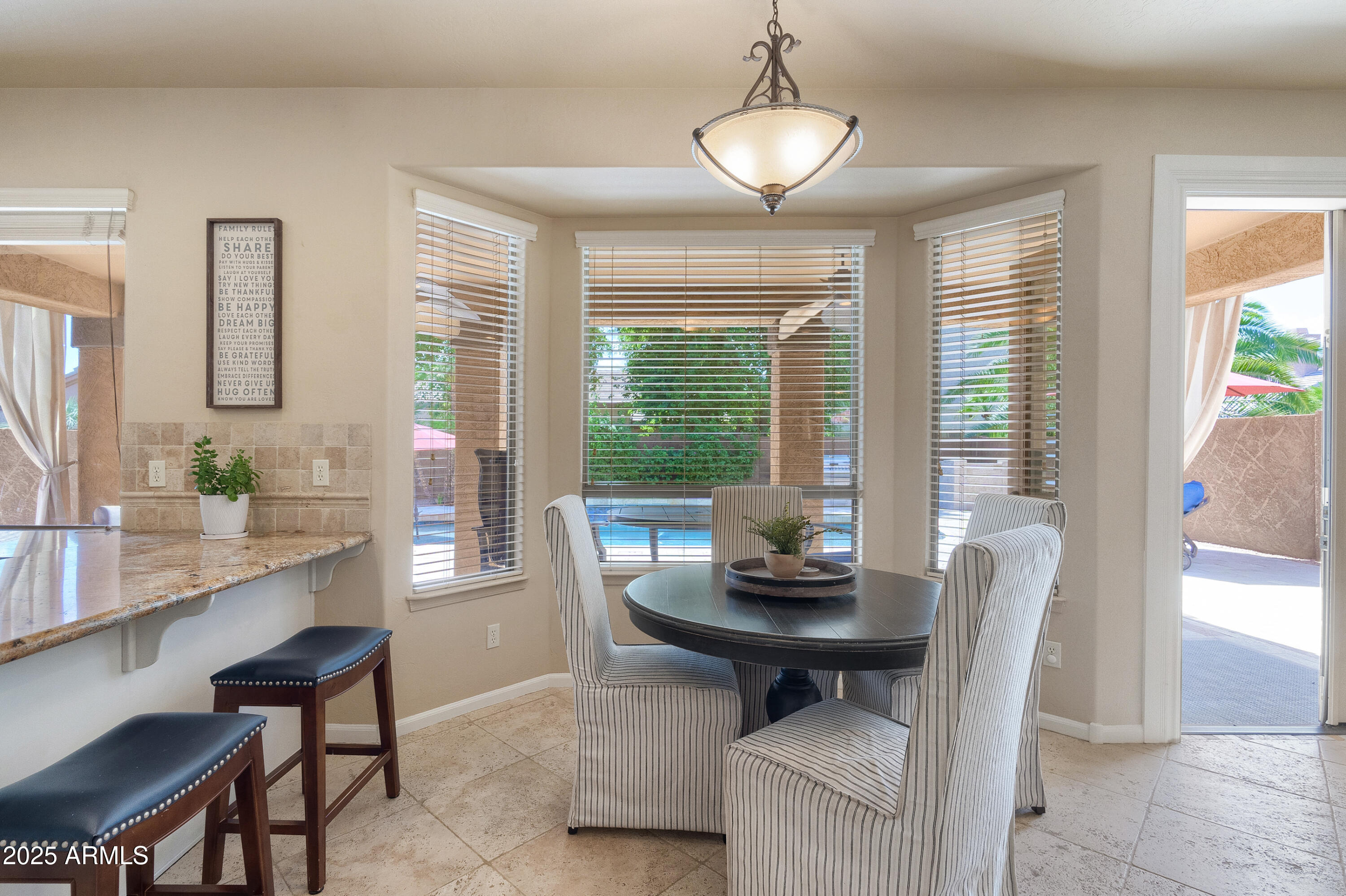 6419 East Betty Elyse Lane Scottsdale, AZ 85254 - Photo 9 of 33 a view of a dining room with furniture window and outside view