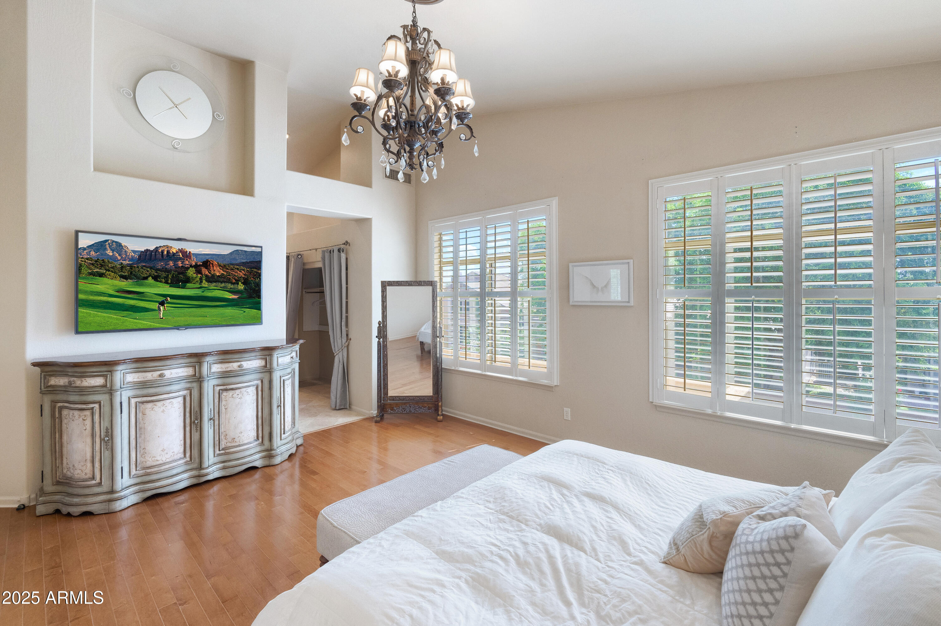 6419 East Betty Elyse Lane Scottsdale, AZ 85254 - Photo 10 of 33 a bedroom with furniture and a flat screen tv